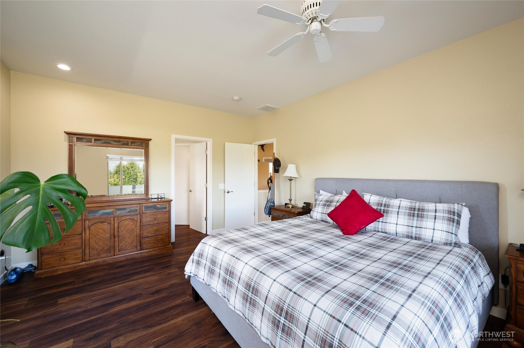 3167 Unick Road Ferndale, WA 98248 - Photo 13 of 40 a bedroom with a bed and a chandelier