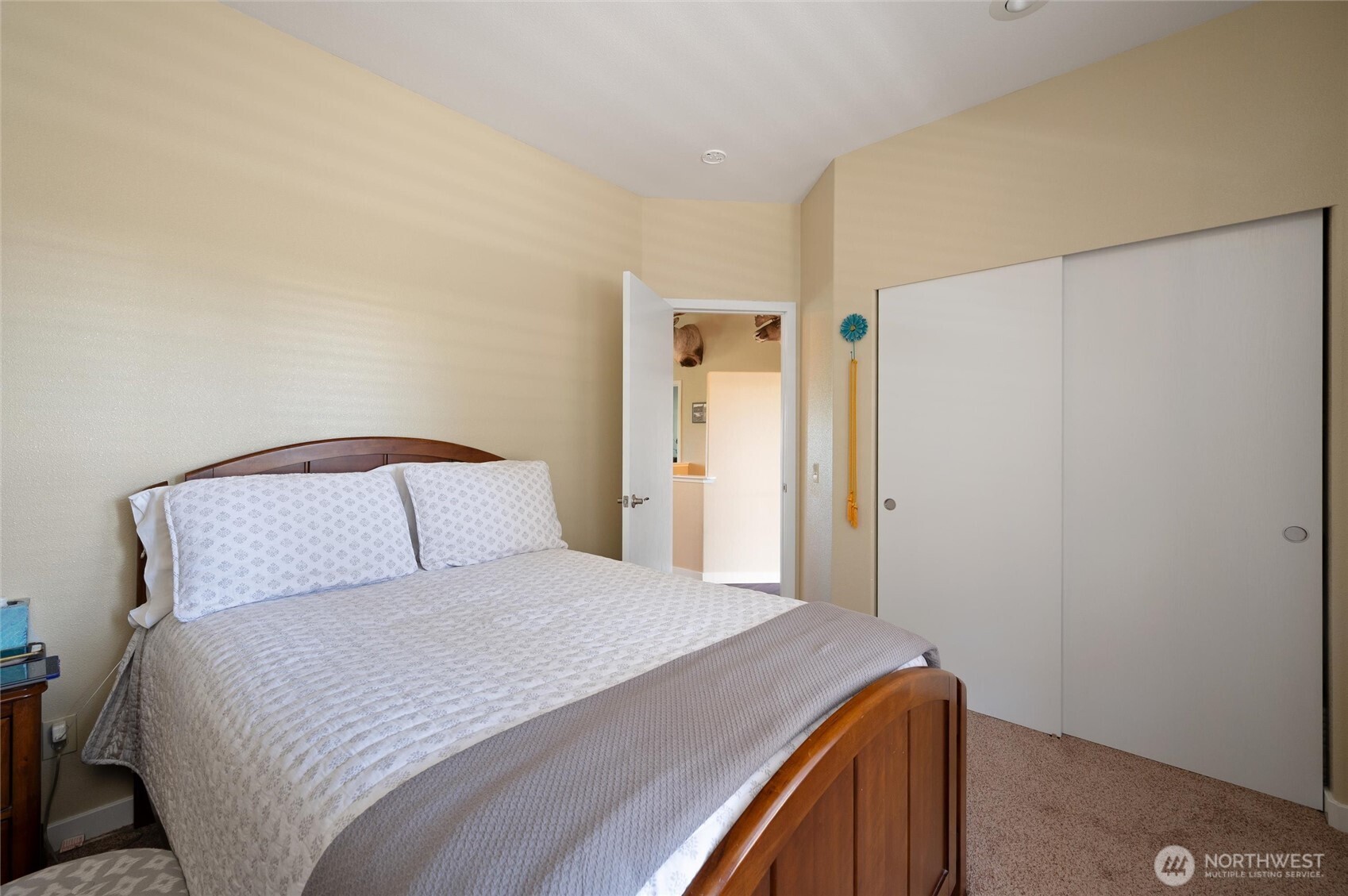 3167 Unick Road Ferndale, WA 98248 - Photo 18 of 40 a bedroom with a bed and a mirror