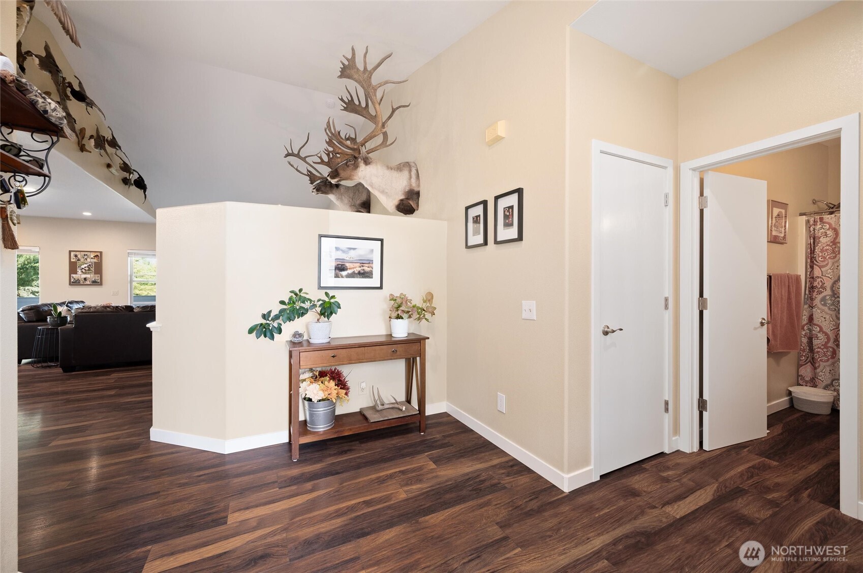 3167 Unick Road Ferndale, WA 98248 - Photo 20 of 40 a view of a livingroom with wooden floor and a hallway