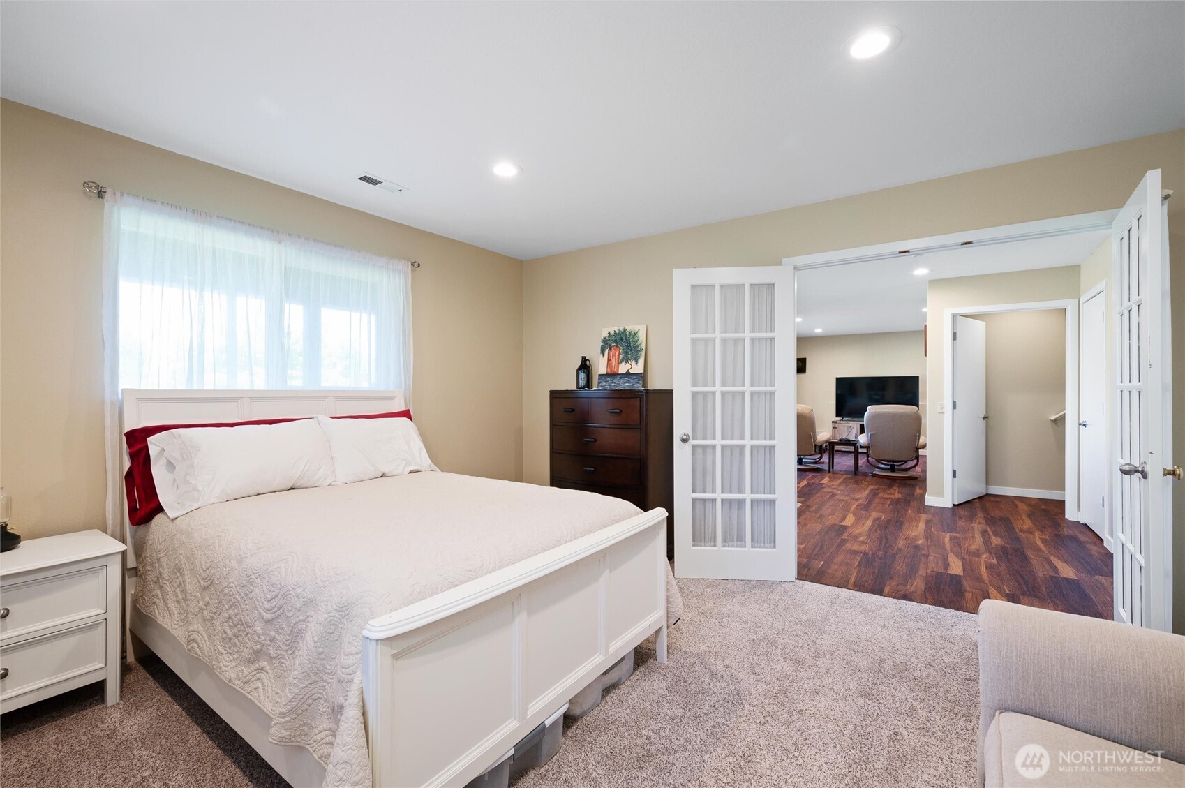 3167 Unick Road Ferndale, WA 98248 - Photo 24 of 40 a large bedroom with a bed and a large mirror