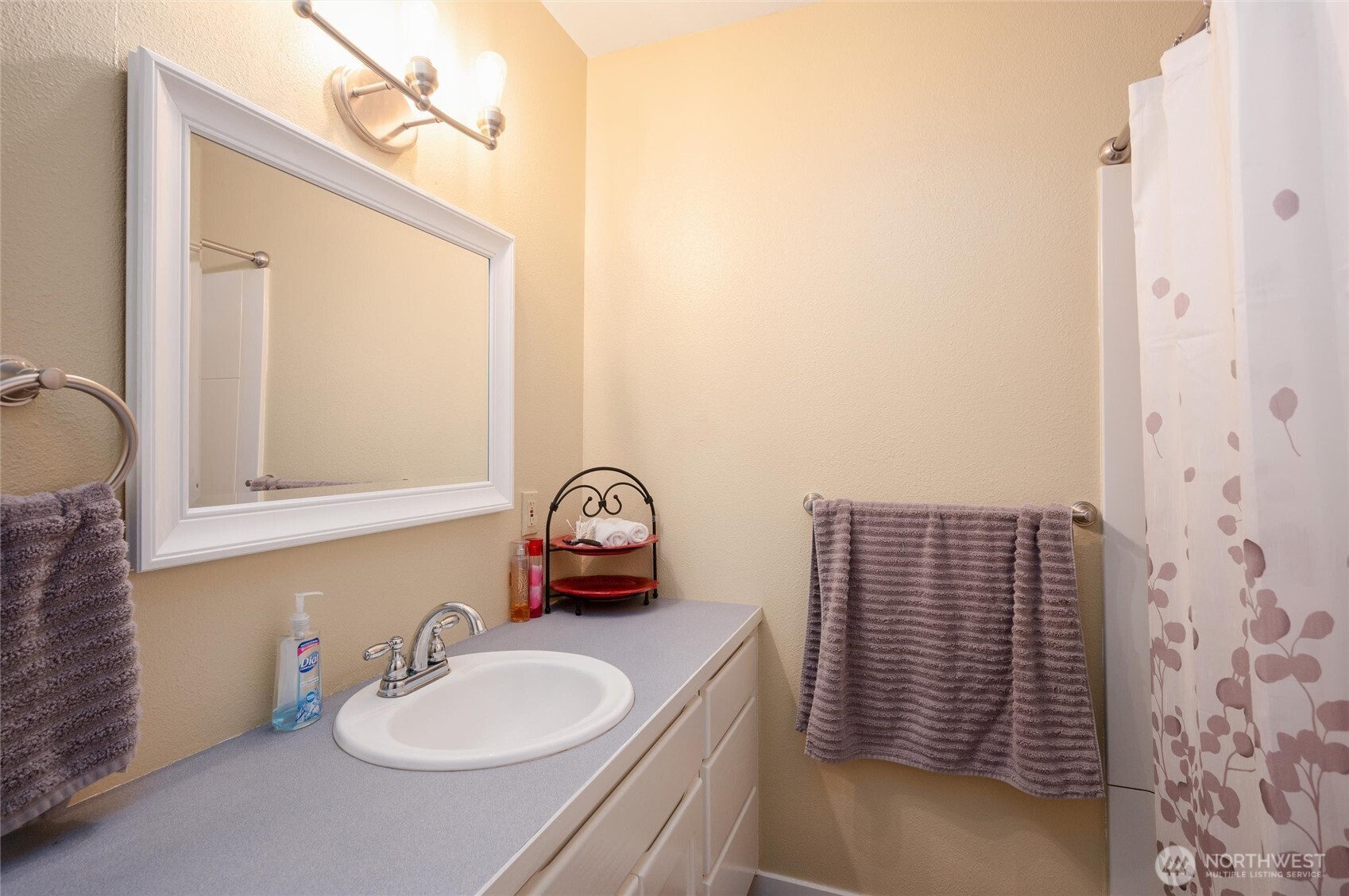 3167 Unick Road Ferndale, WA 98248 - Photo 25 of 40 a bathroom with a sink a toilet and mirror