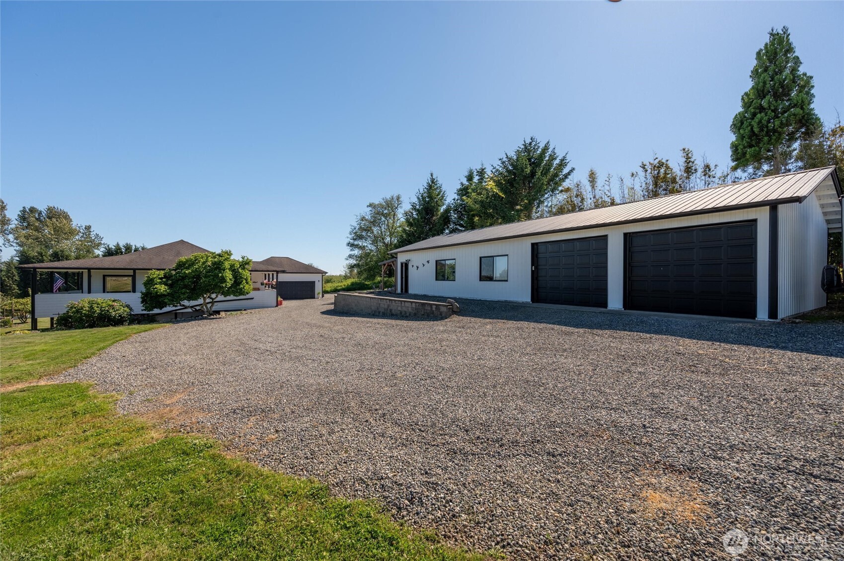 3167 Unick Road Ferndale, WA 98248 - Photo 28 of 40 a front view of house with yard and trees in the background