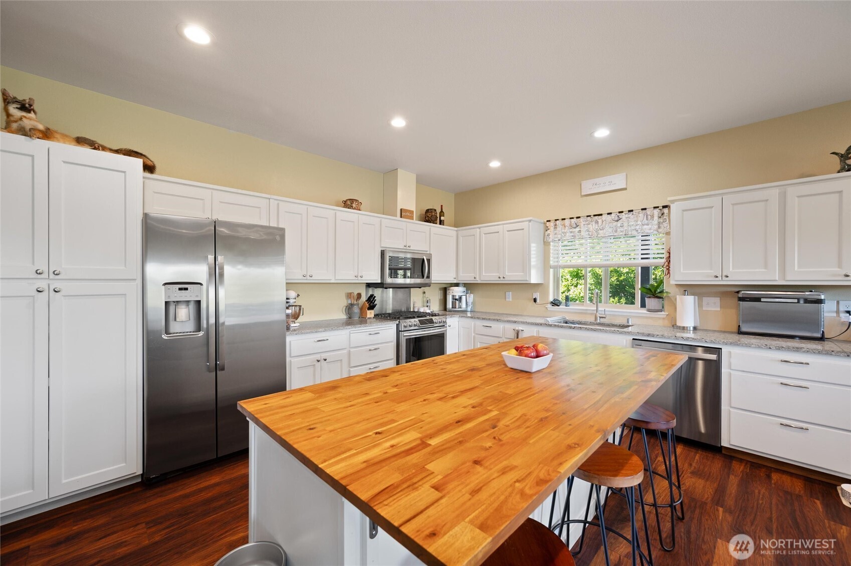 3167 Unick Road Ferndale, WA 98248 - Photo 5 of 40 a kitchen with stainless steel appliances kitchen island granite countertop a refrigerator and a stove top oven