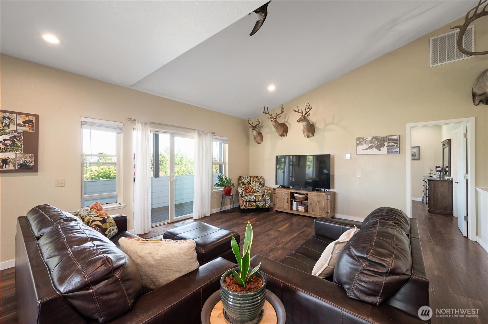 3167 Unick Road Ferndale, WA 98248 - Photo 10 of 40 a living room with furniture and a flat screen tv