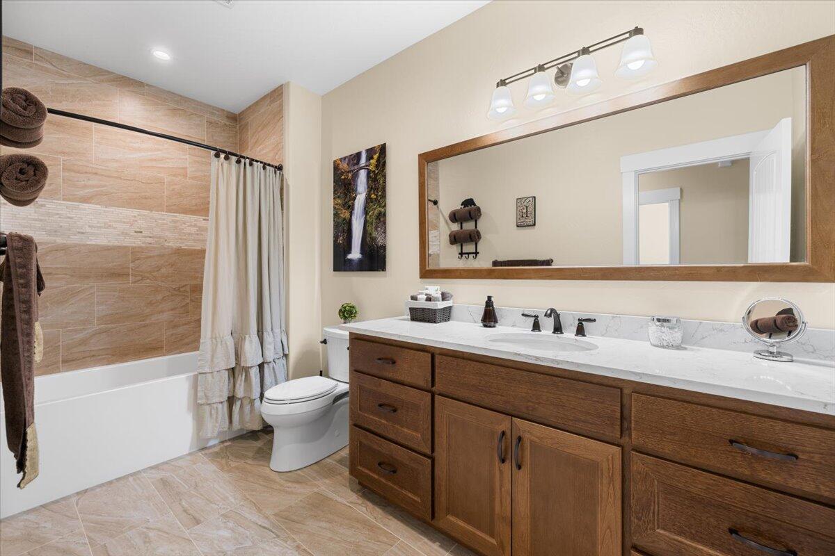 1323 Ellison Loop Merlin, OR 97532 - Photo 16 of 24 Beautiful tile Shower over nice deep tub, Tile floors. Spacious countertop, extra large mirror and storage.