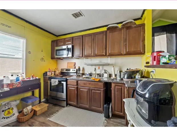 an aerial view of a house with a lake view
