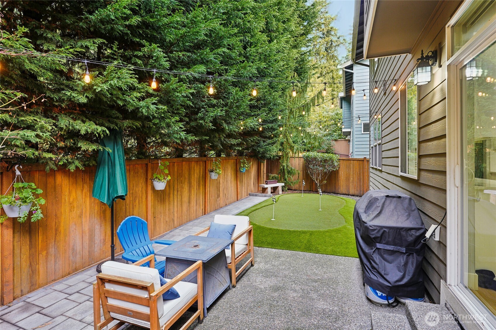 6523 128th Place Southwest Edmonds, WA 98026 - Photo 11 of 35 a backyard of a house with barbeque oven fire pit table and chairs