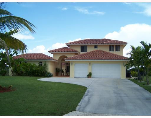 19100 Southwest 63rd Street Southwest Ranches, FL 33332 - Photo 1 of 9 a front view of a house with garden