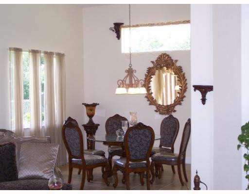 19100 Southwest 63rd Street Southwest Ranches, FL 33332 - Photo 6 of 9 a view of a dining room with furniture and chandelier