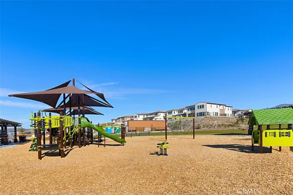 a view of swimming pool with lawn chairs