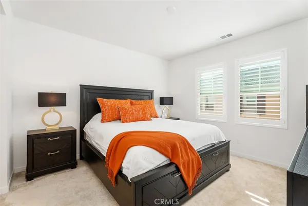 a bedroom with a bed and dresser