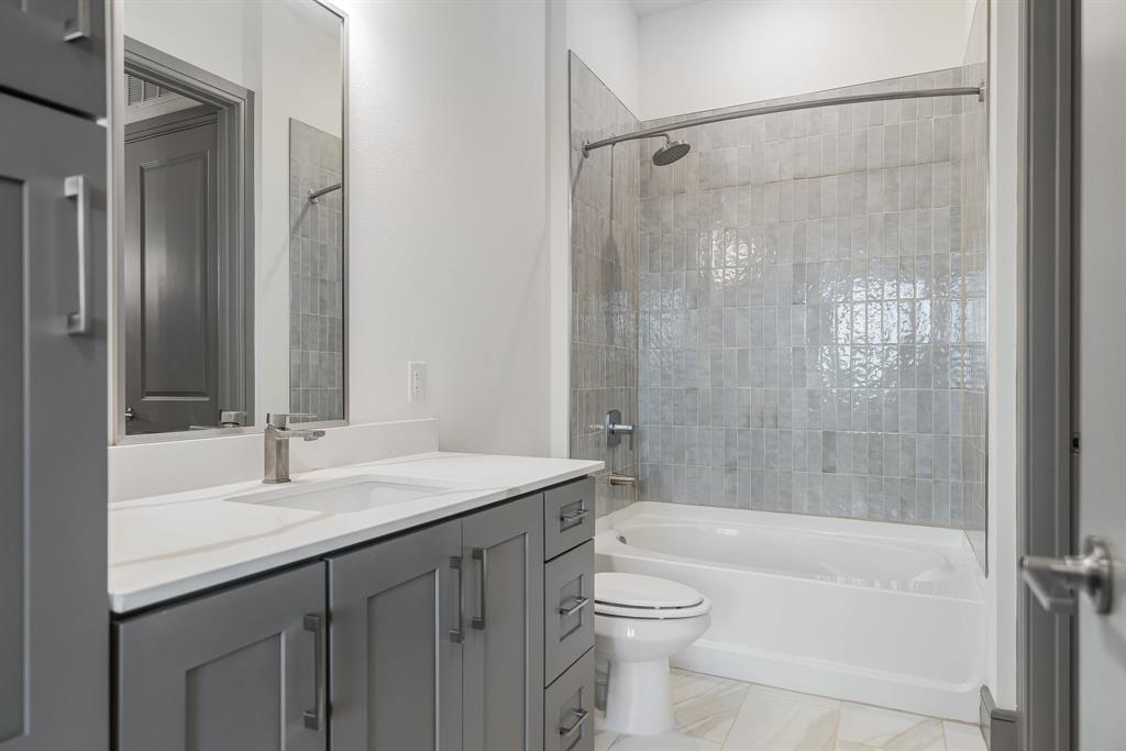 2700 Old Denton Road, Unit 3336 Carrollton, TX 75007 - Photo 12 of 28 a bathroom with a sink a toilet and shower