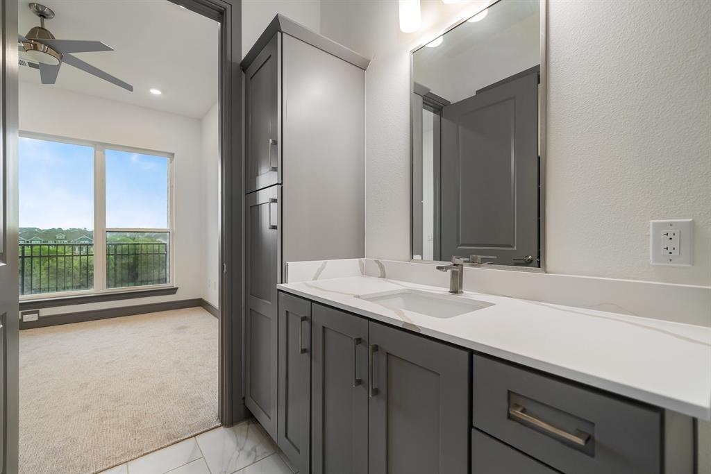 2700 Old Denton Road, Unit 3336 Carrollton, TX 75007 - Photo 14 of 28 a bathroom with a sink and a mirror