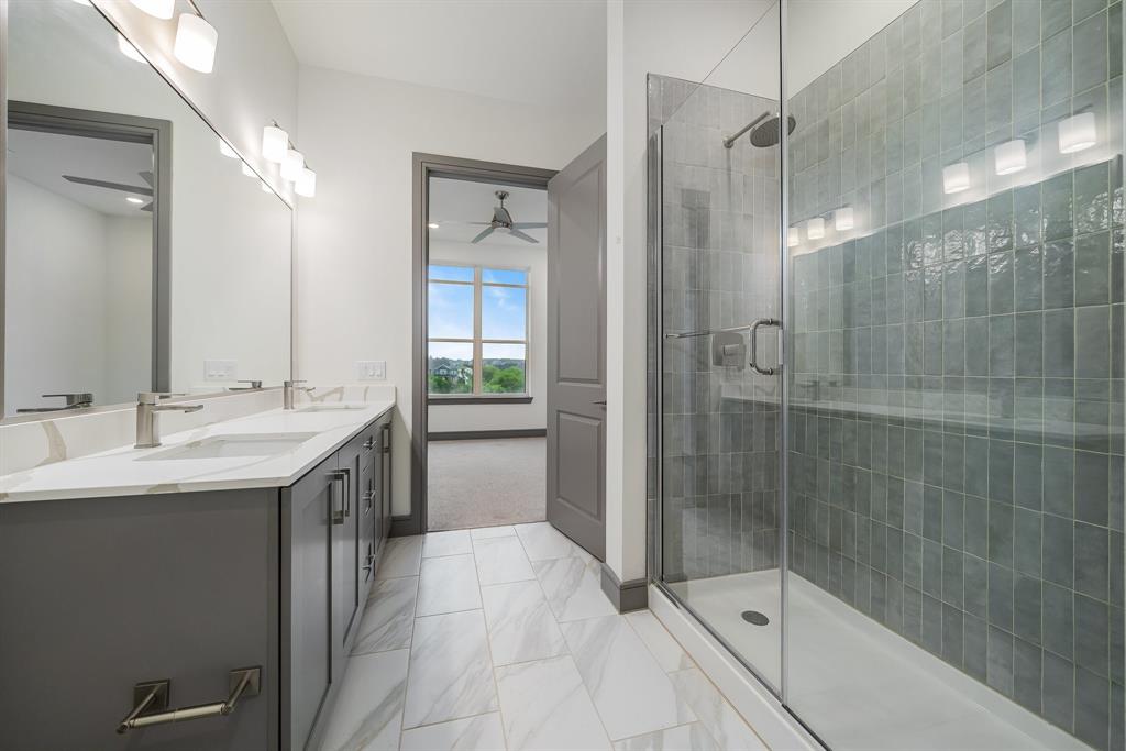2700 Old Denton Road, Unit 3336 Carrollton, TX 75007 - Photo 18 of 28 a bathroom with a shower sink and mirror
