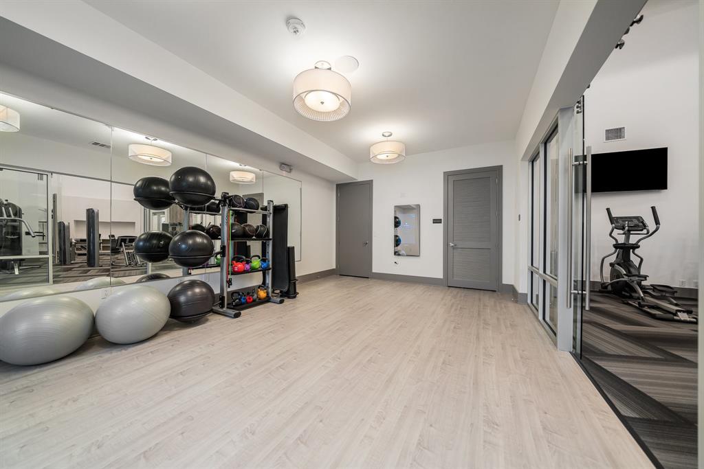 2700 Old Denton Road, Unit 3336 Carrollton, TX 75007 - Photo 23 of 28 a view of a room with gym equipment