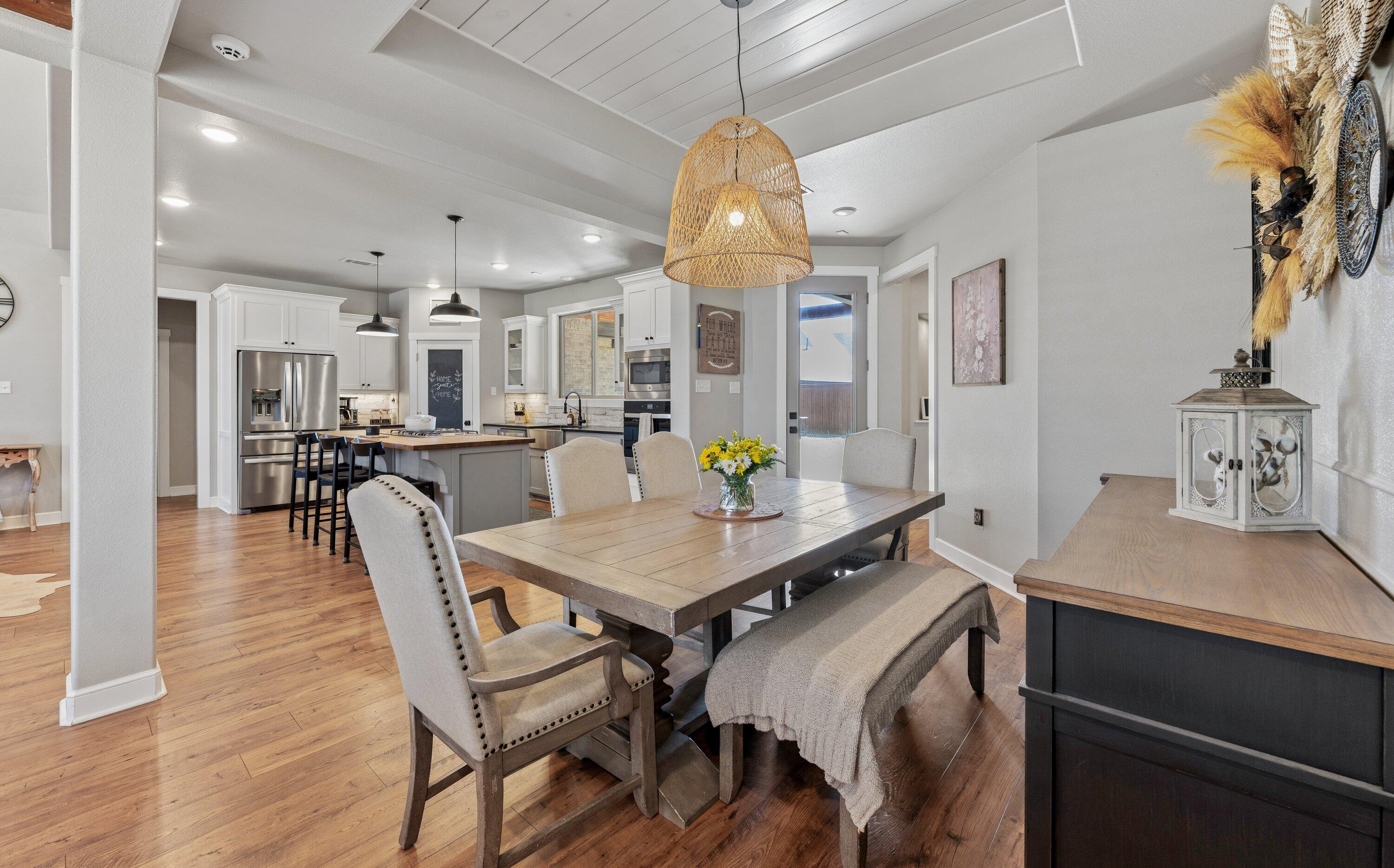629 North 9th Street Wolfforth, TX 79382 - Photo 18 of 45 a view of a dining room with furniture and a chandelier
