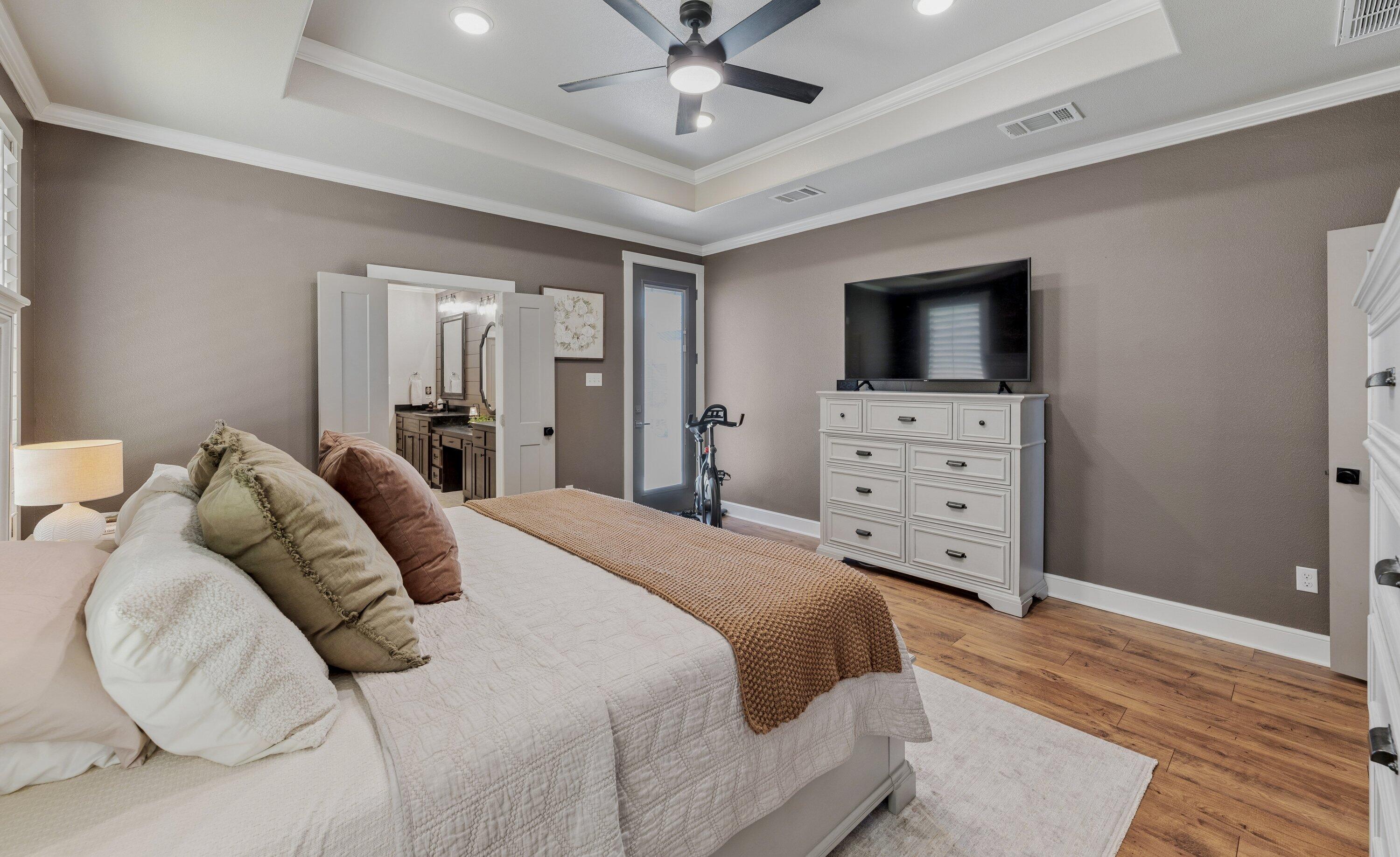 629 North 9th Street Wolfforth, TX 79382 - Photo 22 of 45 a bedroom with a bed and a flat screen tv