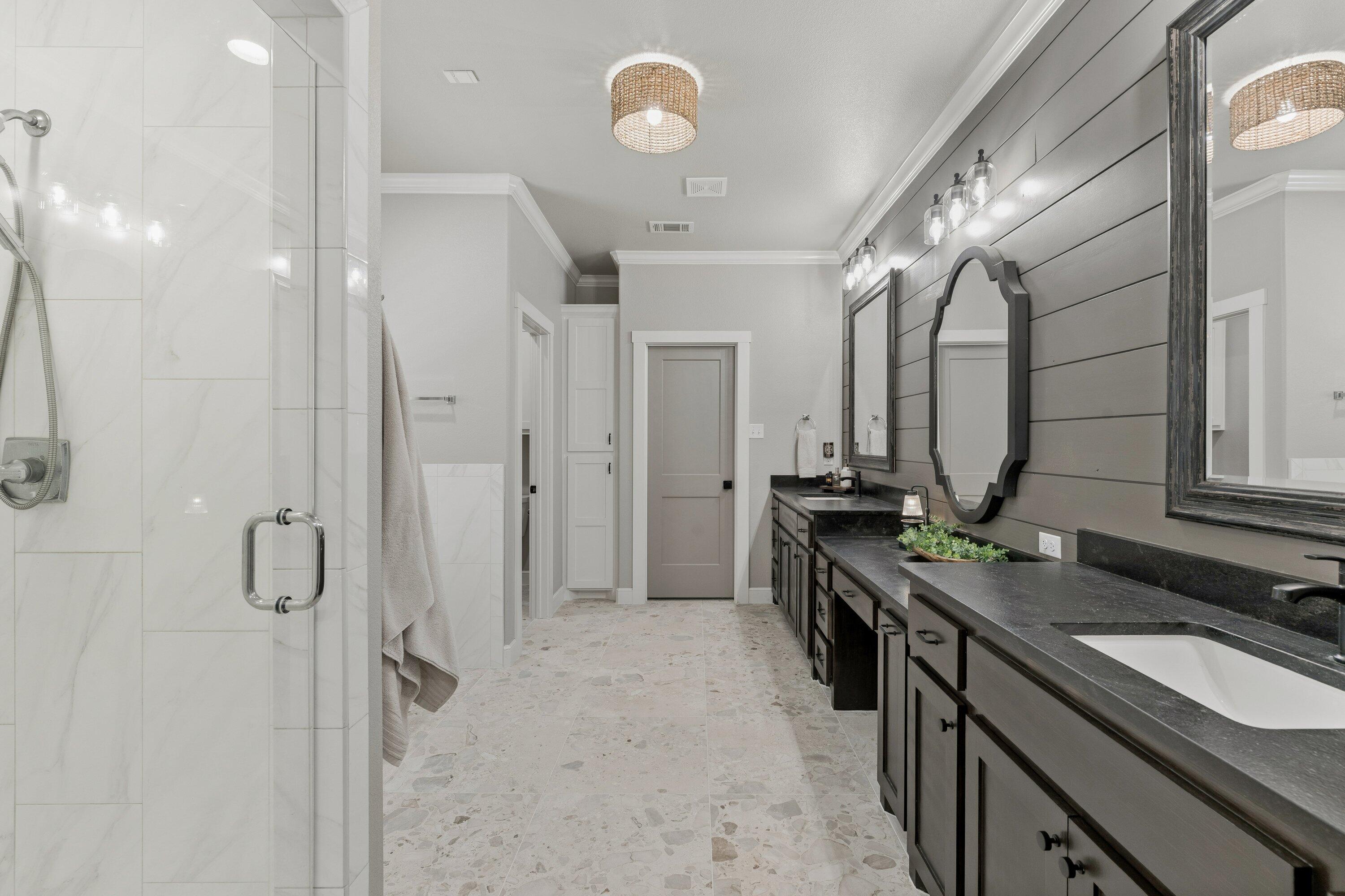 629 North 9th Street Wolfforth, TX 79382 - Photo 23 of 45 a spacious bathroom with a double vanity sink a mirror and a shower