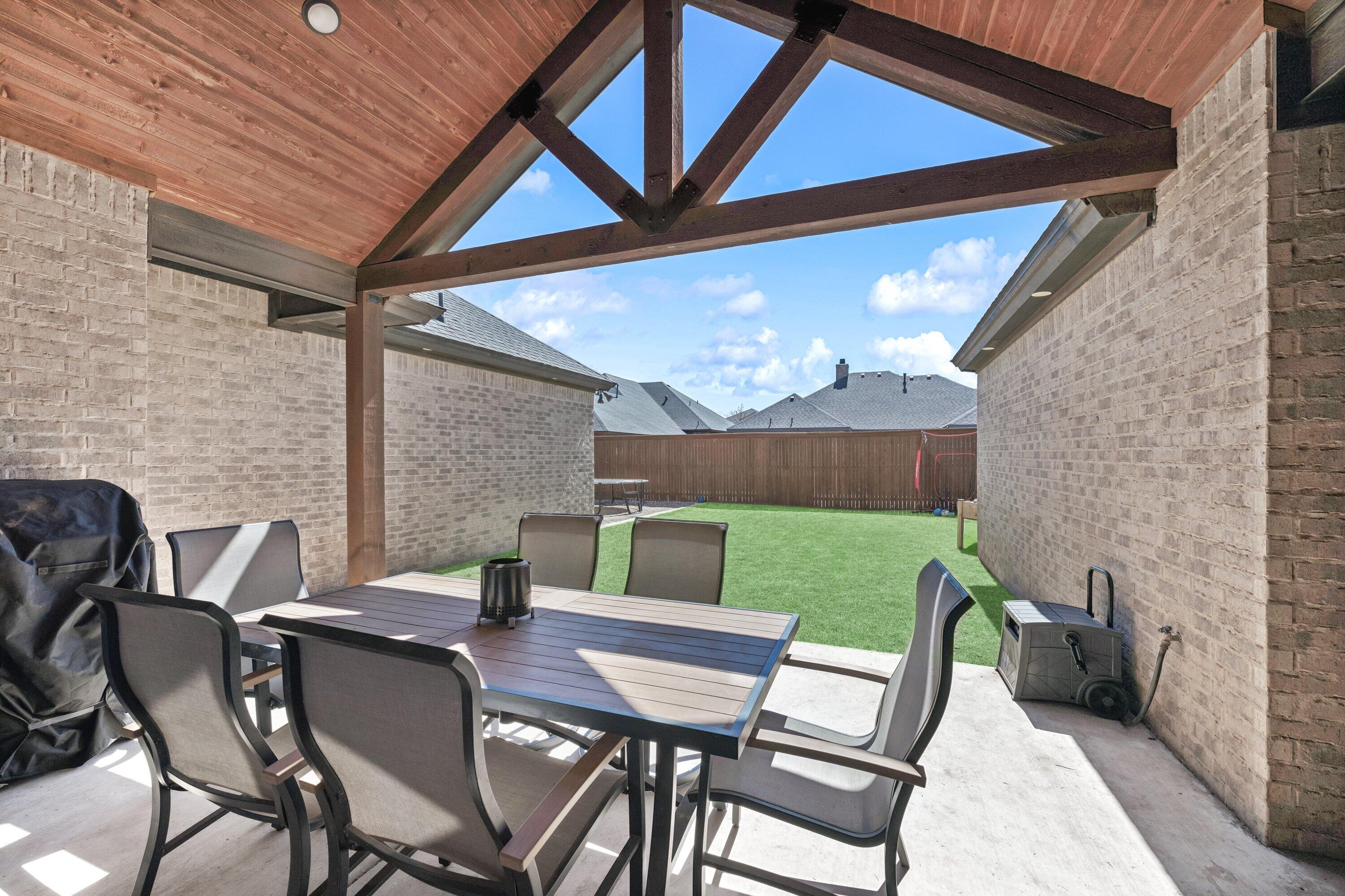 629 North 9th Street Wolfforth, TX 79382 - Photo 35 of 45 a view of a patio with a table and chairs