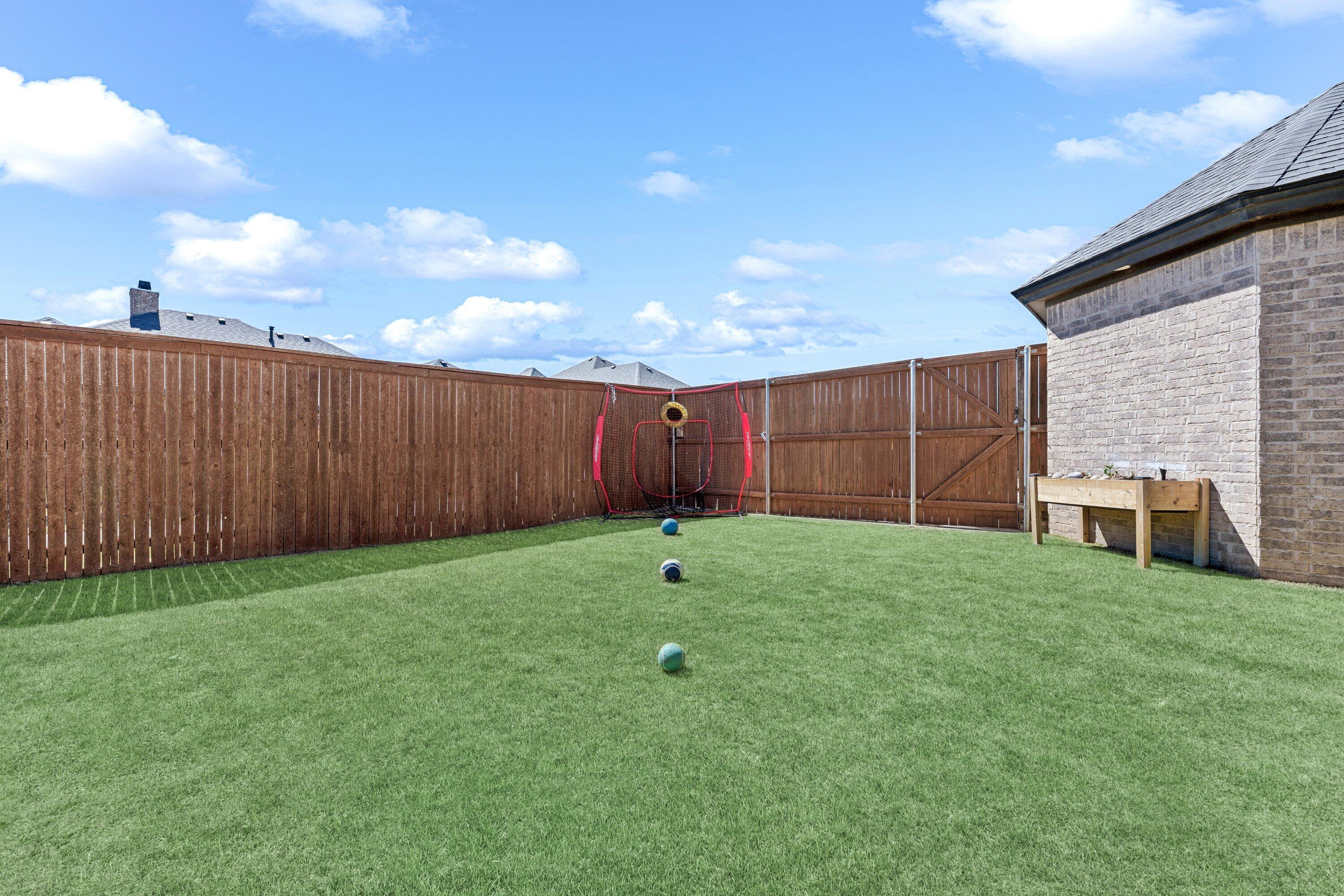 629 North 9th Street Wolfforth, TX 79382 - Photo 39 of 45 a view of a backyard with brick wall and wooden fence