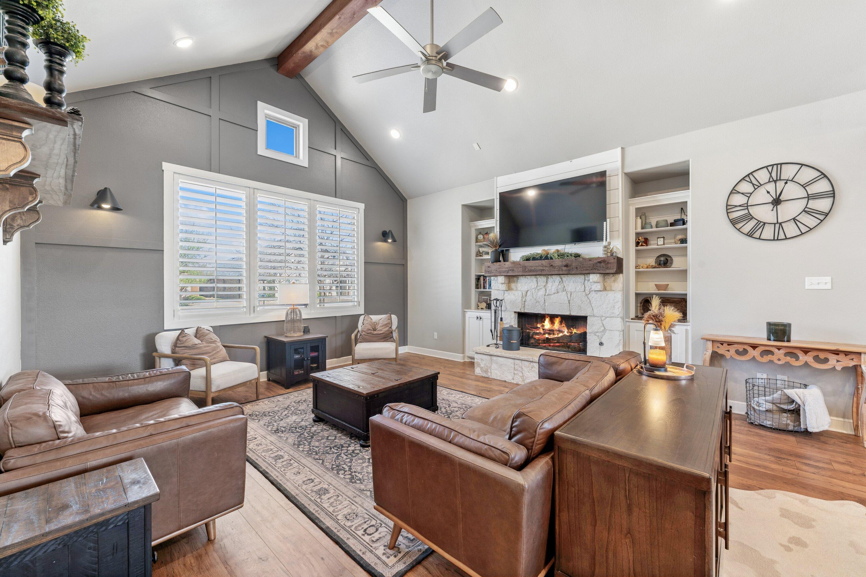 629 North 9th Street Wolfforth, TX 79382 - Photo 5 of 45 a living room with fireplace furniture and a flat screen tv