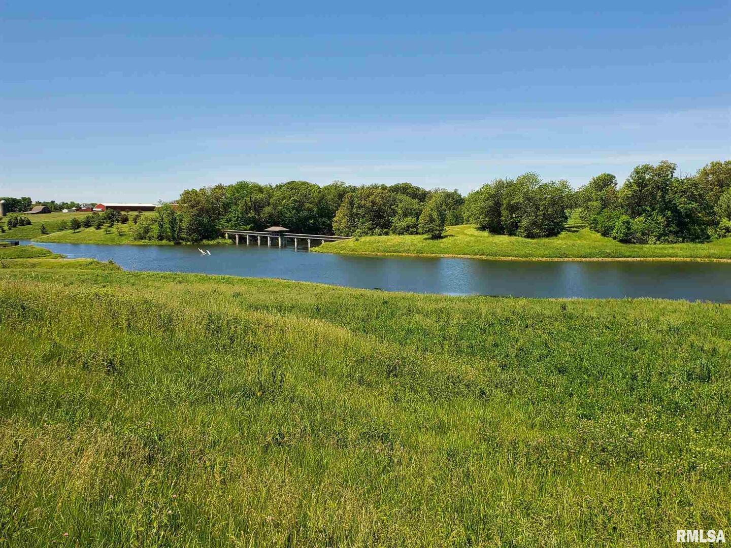 Lot 2 52nd Street West Milan, IL 61264 - Photo 16 of 18 a view of a lake with houses in the back