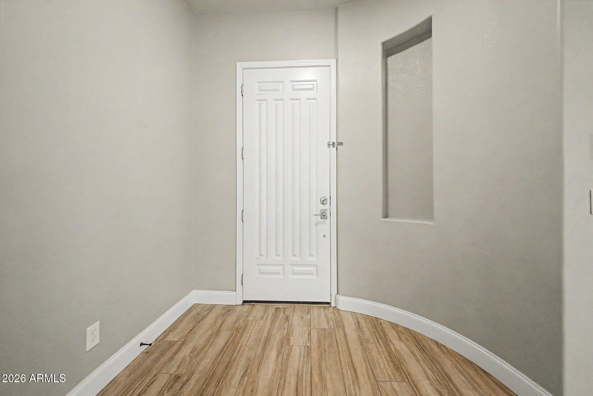 4272 East Buckboard Road Gilbert, AZ 85297 - Photo 8 of 37 a view of an empty room with wooden floor