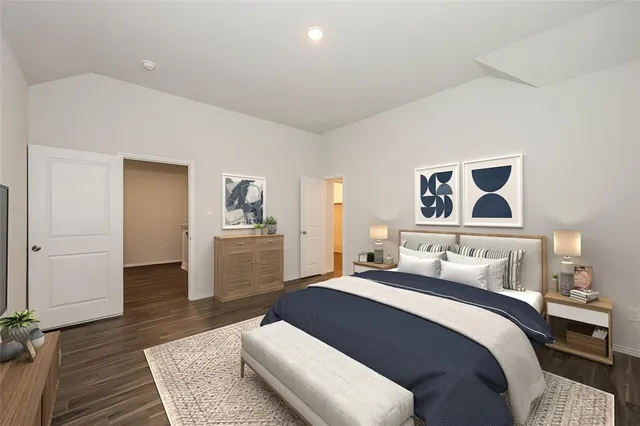 a bedroom with a bed and a couch