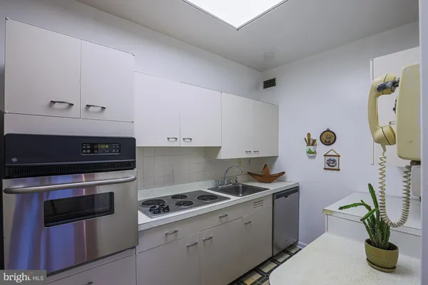 a kitchen with a stove and a refrigerator