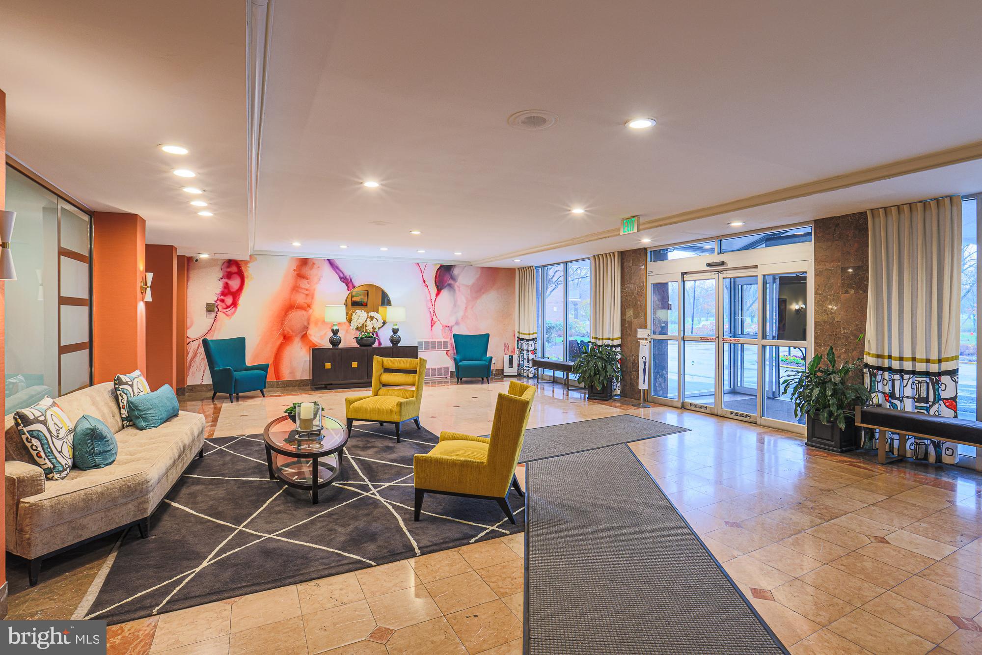 11 Slade, Unit 614 Pikesville, MD 21208 - Photo 32 of 38 a living room with furniture and a large window