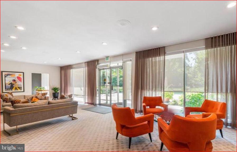 11 Slade, Unit 614 Pikesville, MD 21208 - Photo 35 of 38 a living room with furniture and a large window