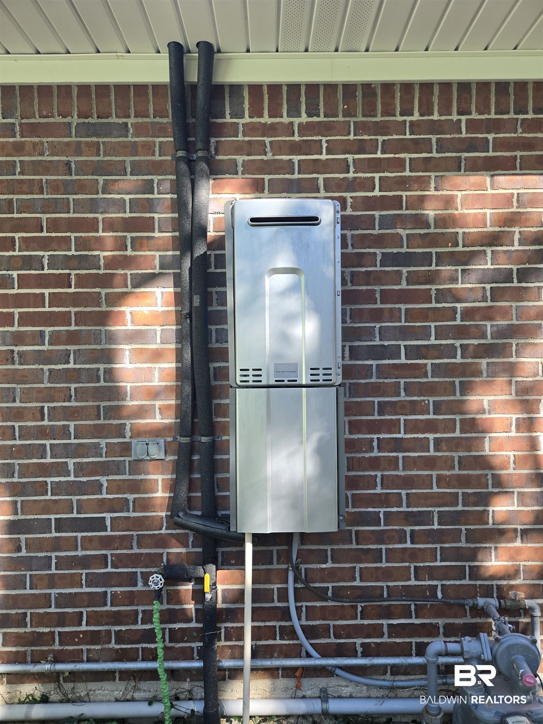 2554 Riverside Drive Mobile, AL 36605 - Photo 27 of 43 Exterior view of brick wall and water heater