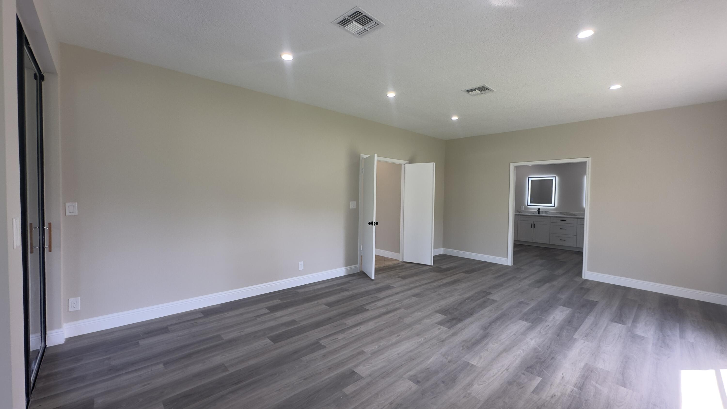 11330 Timber Lodge Terrace Boca Raton, FL 33428 - Photo 14 of 23 a view of an empty room with wooden floor