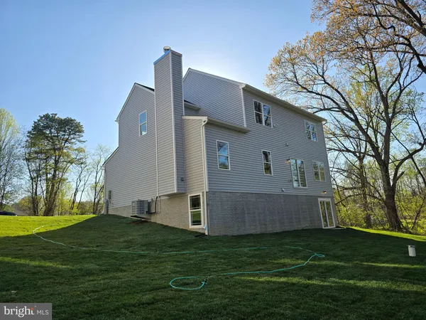 a kitchen with stainless steel appliances a stove sink microwave and cabinets