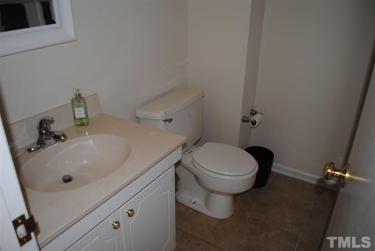 5508 Knollwood Road Raleigh, NC 27609 - Photo 11 of 19 a bathroom with a sink and toilet