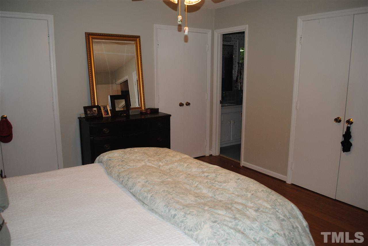 5508 Knollwood Road Raleigh, NC 27609 - Photo 15 of 19 a bedroom with a bed and a dresser