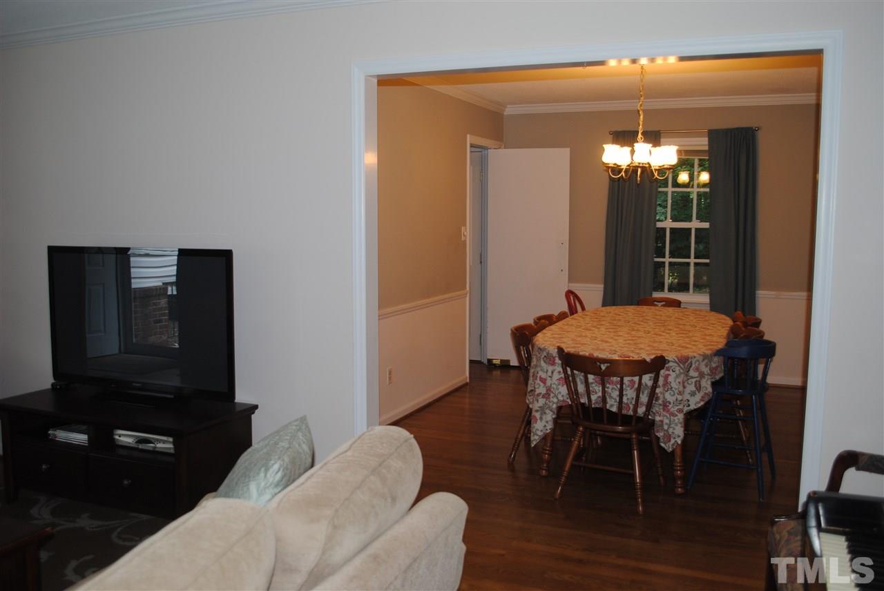 5508 Knollwood Road Raleigh, NC 27609 - Photo 4 of 19 a view of a dining room with furniture and wooden floor