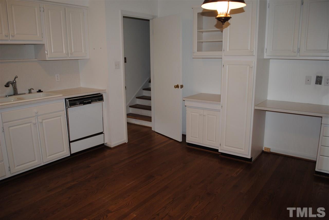 5508 Knollwood Road Raleigh, NC 27609 - Photo 7 of 19 a kitchen with wooden floors and white appliances