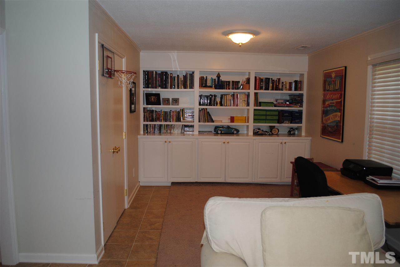 5508 Knollwood Road Raleigh, NC 27609 - Photo 10 of 19 a room with a book shelf and a book shelf