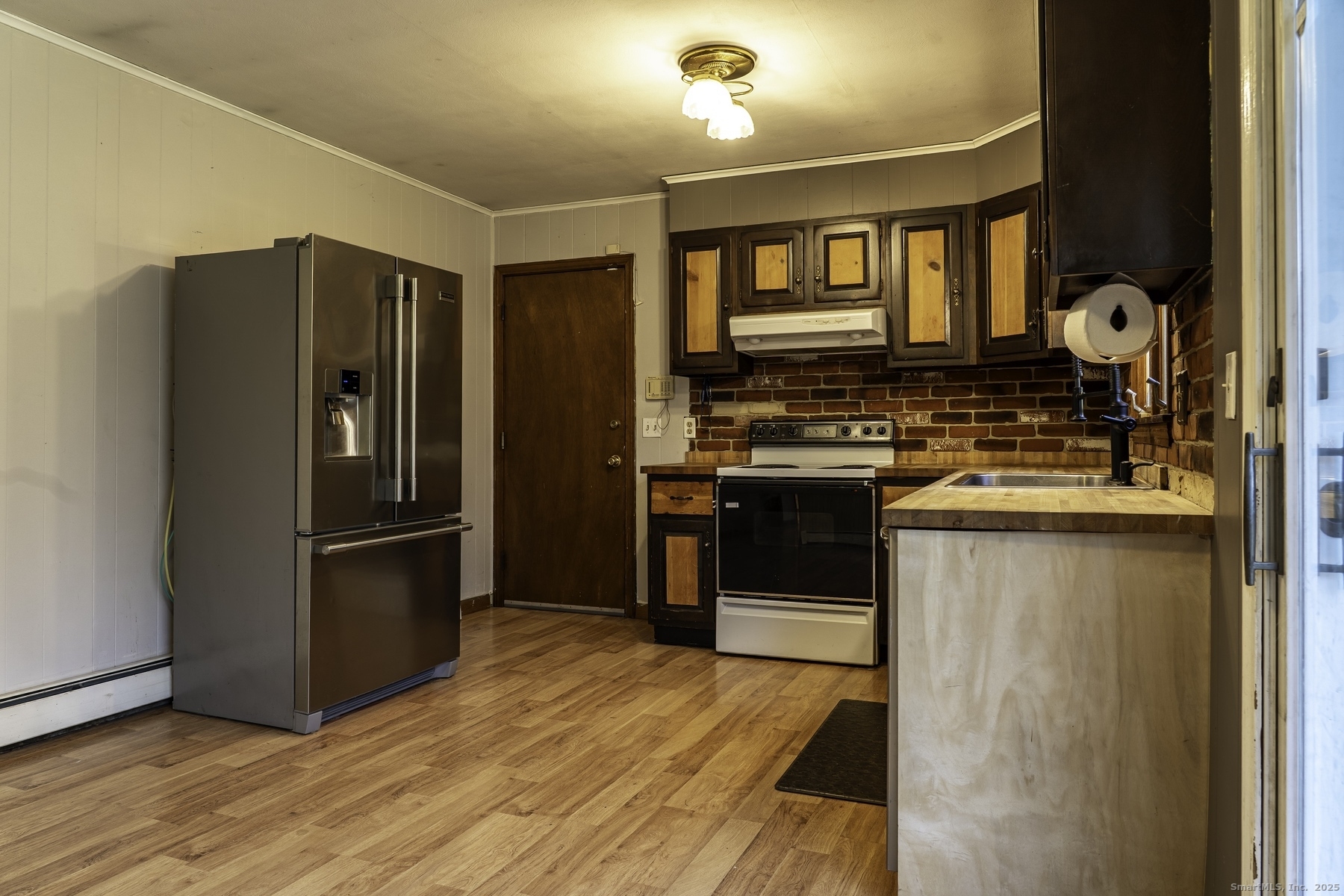 142 Starr Street Norwich, CT 06360 - Photo 17 of 32 a kitchen with stainless steel appliances granite countertop a refrigerator stove and sink