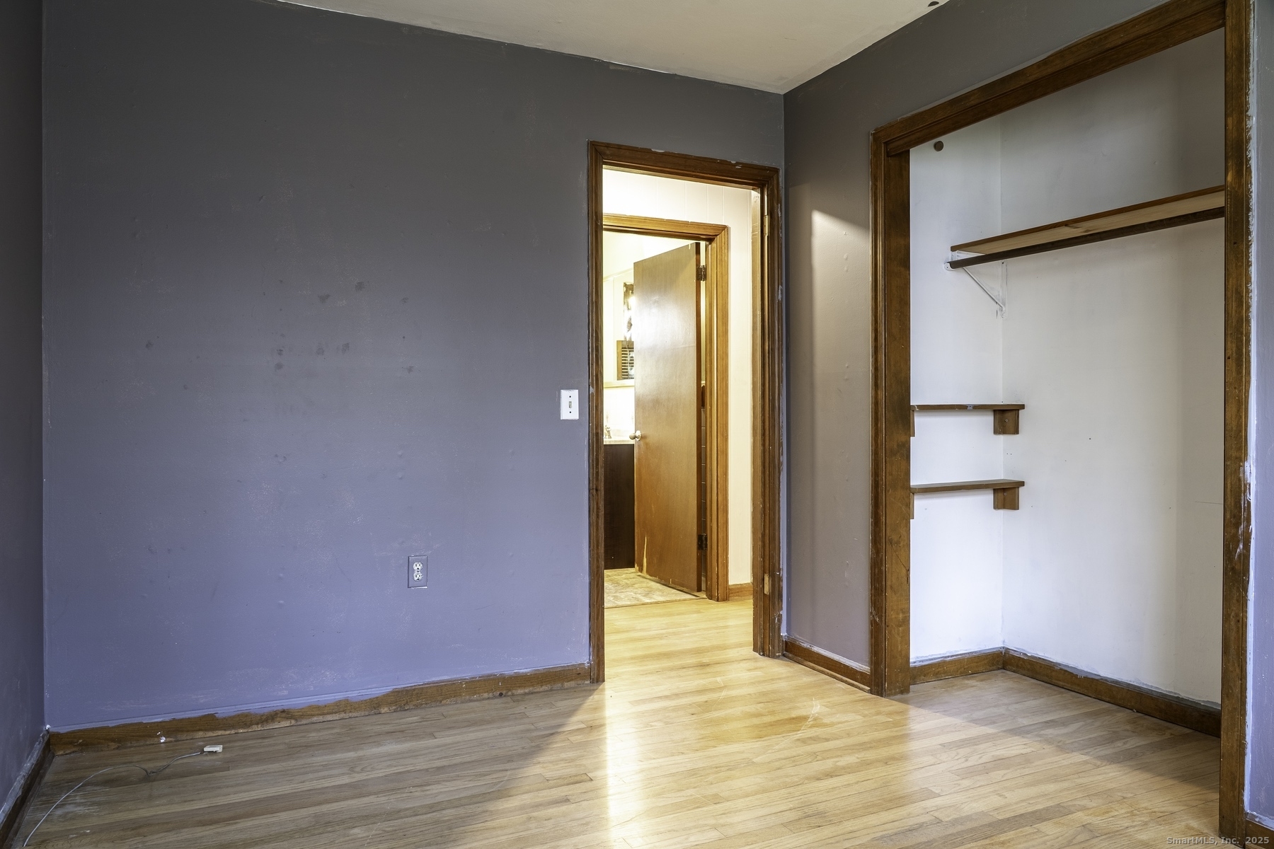 142 Starr Street Norwich, CT 06360 - Photo 23 of 32 an empty room with wooden floor and a window