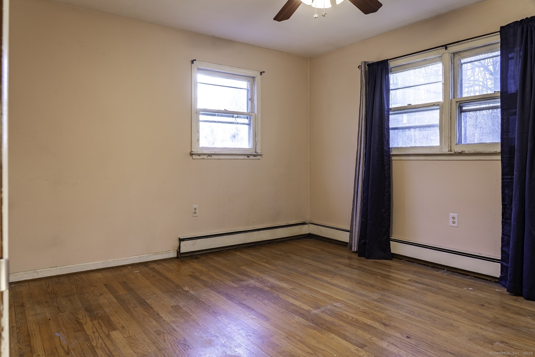 142 Starr Street Norwich, CT 06360 - Photo 26 of 32 wooden floor in an empty room with a window