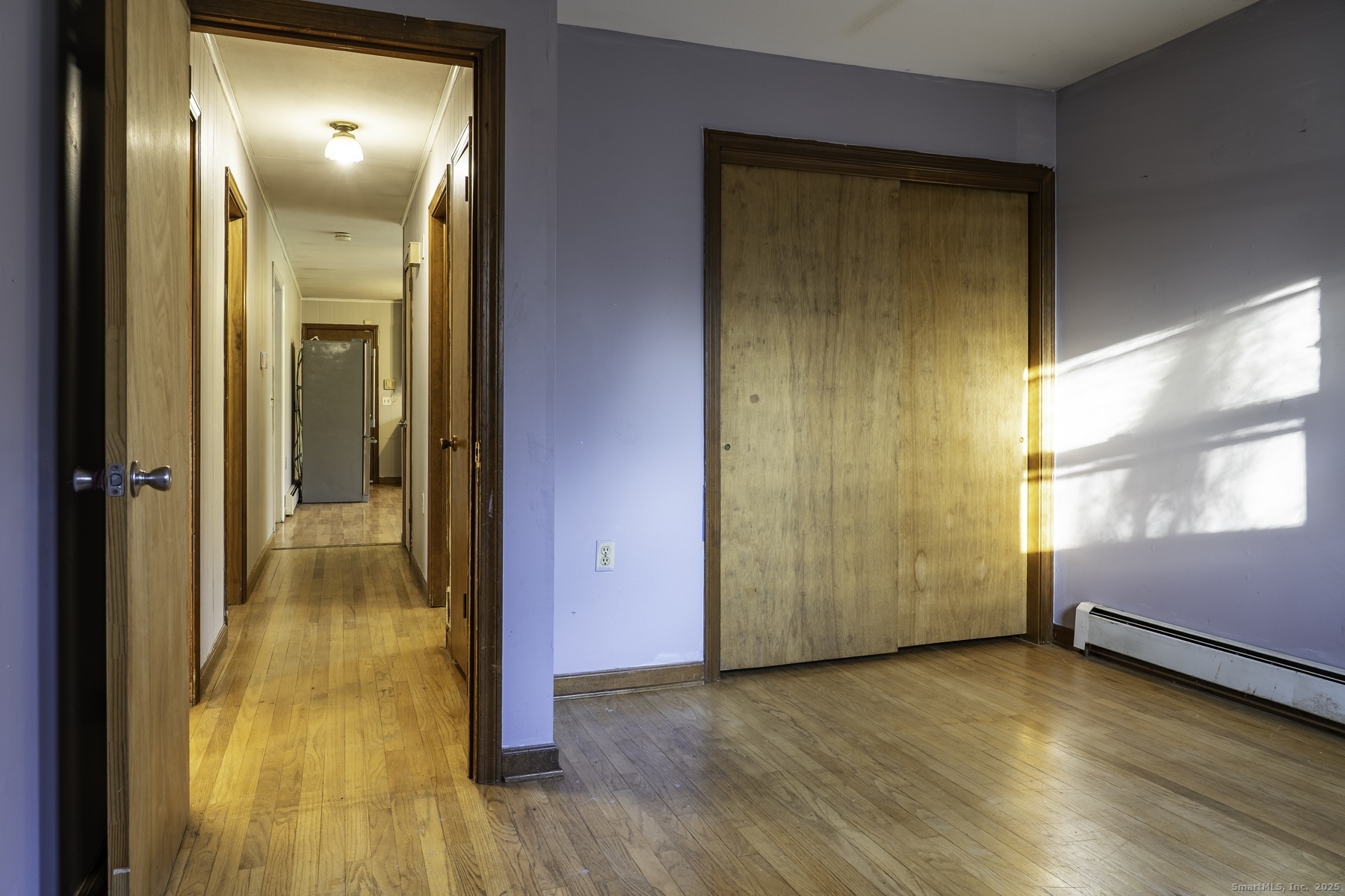 142 Starr Street Norwich, CT 06360 - Photo 29 of 32 a view of a room with wooden floor and a window