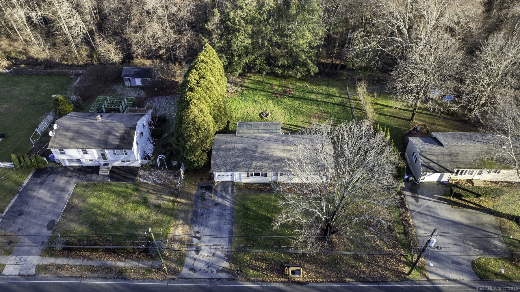142 Starr Street Norwich, CT 06360 - Photo 5 of 32 a backyard of a house with a yard and outdoor seating