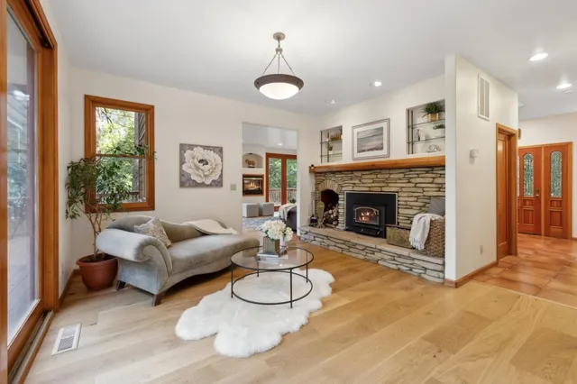 a kitchen with stainless steel appliances granite countertop a stove a sink and a microwave