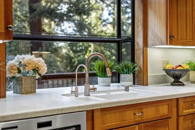 a view of a livingroom with workspace and a window