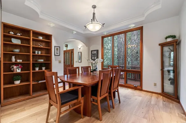 a view of a livingroom with workspace and a window
