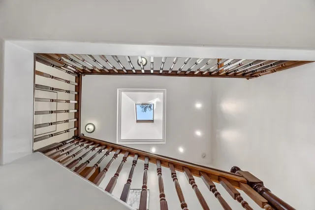 a large bedroom with a large bed and furniture