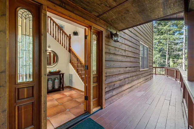 a view of entryway with wooden floor