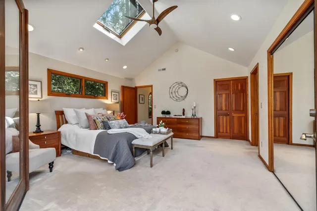 a bathroom with a double vanity sink mirror and shower
